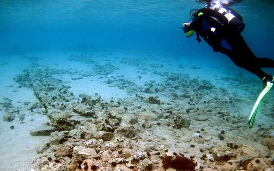 Diver exploring Pavlopetri underwater ruins