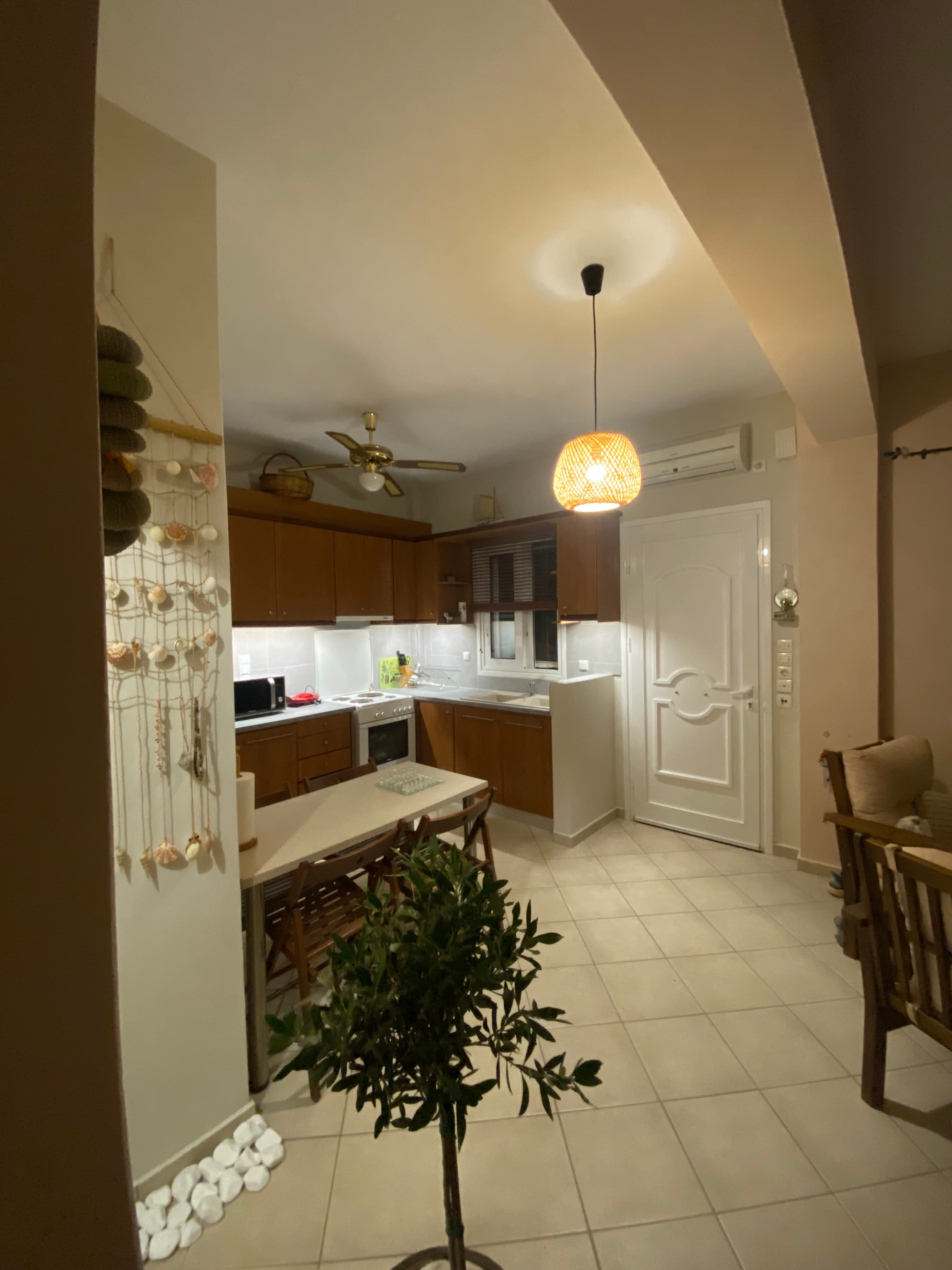 Kitchen with Dark Wood Cabinets (Evening)