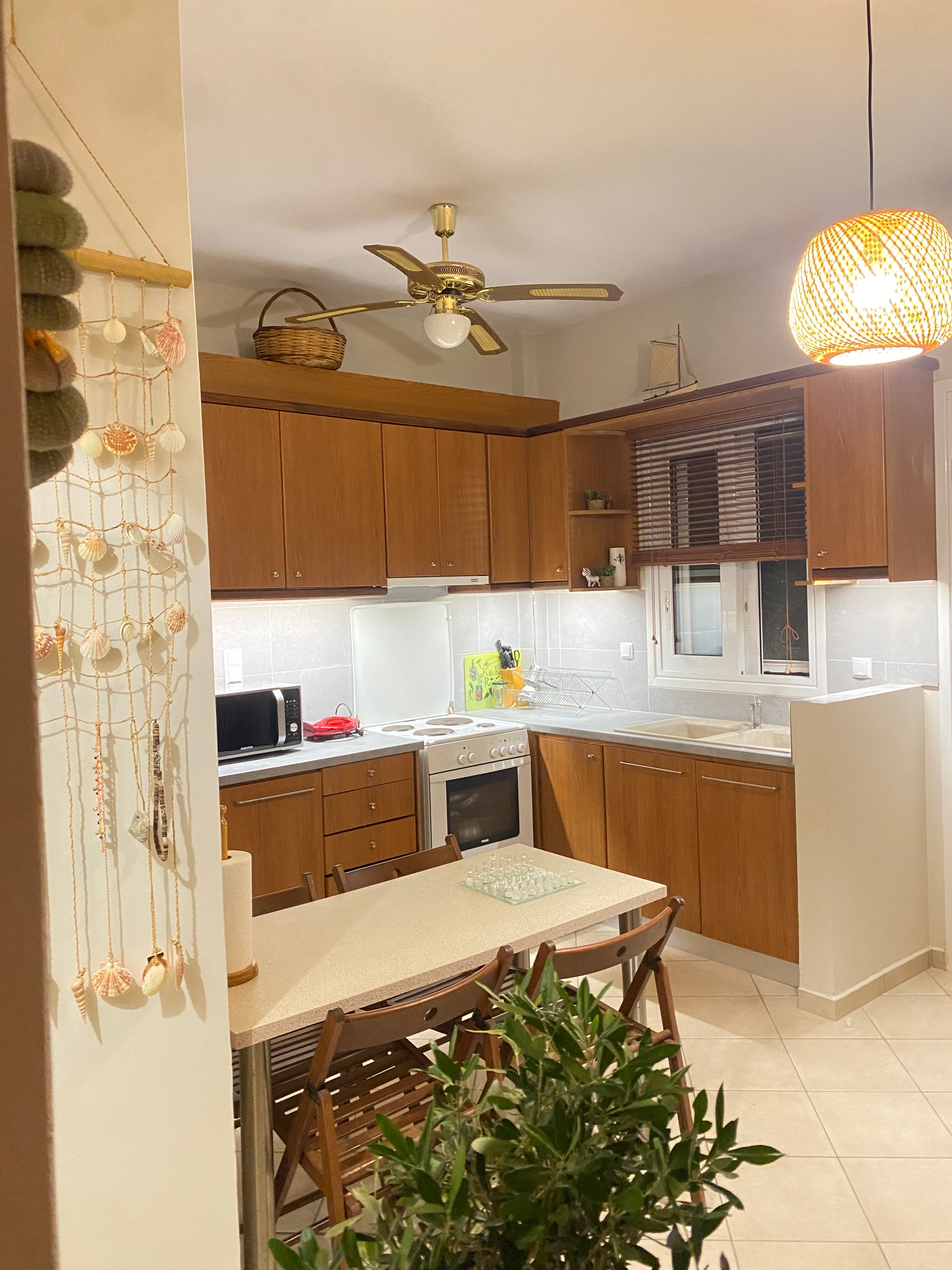 Kitchen with Wooden Cabinets and Ceiling Fan